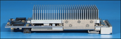 An air-cooled XMC module uses a highly-effective nickel-plated copper band to pull heat from a large FPGA on the underside
of the board into an aluminum finned heat sink sitting in the airflow.